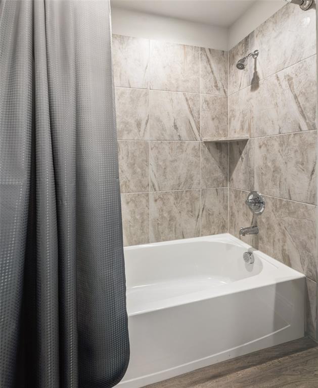 6020 Bursey Road Watauga, TX 76148 - Photo 29 of 33 a bathroom with bathtub and shower