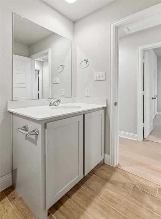6020 Bursey Road Watauga, TX 76148 - Photo 30 of 33 a bathroom with a sink and a mirror