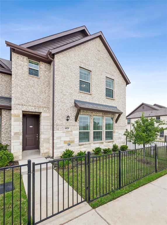 6020 Bursey Road Watauga, TX 76148 - Photo 32 of 33 a front view of a house with a garden and plants