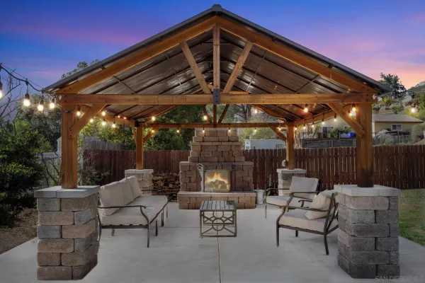 a patio with patio a fire pit and outdoor seating