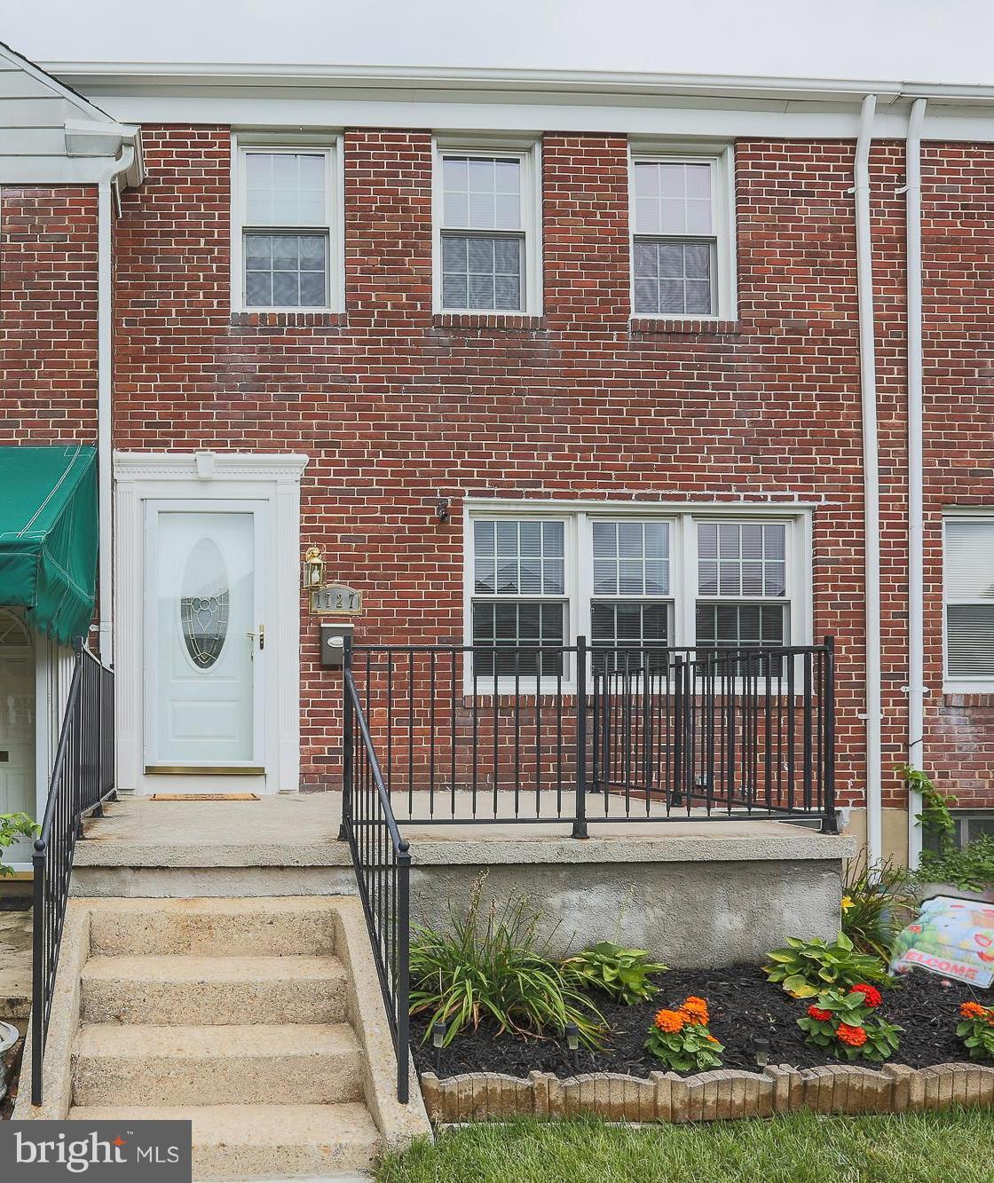 1727 Edgewood Road Towson, MD 21286 - Photo 1 of 29 a front view of a house with a garden
