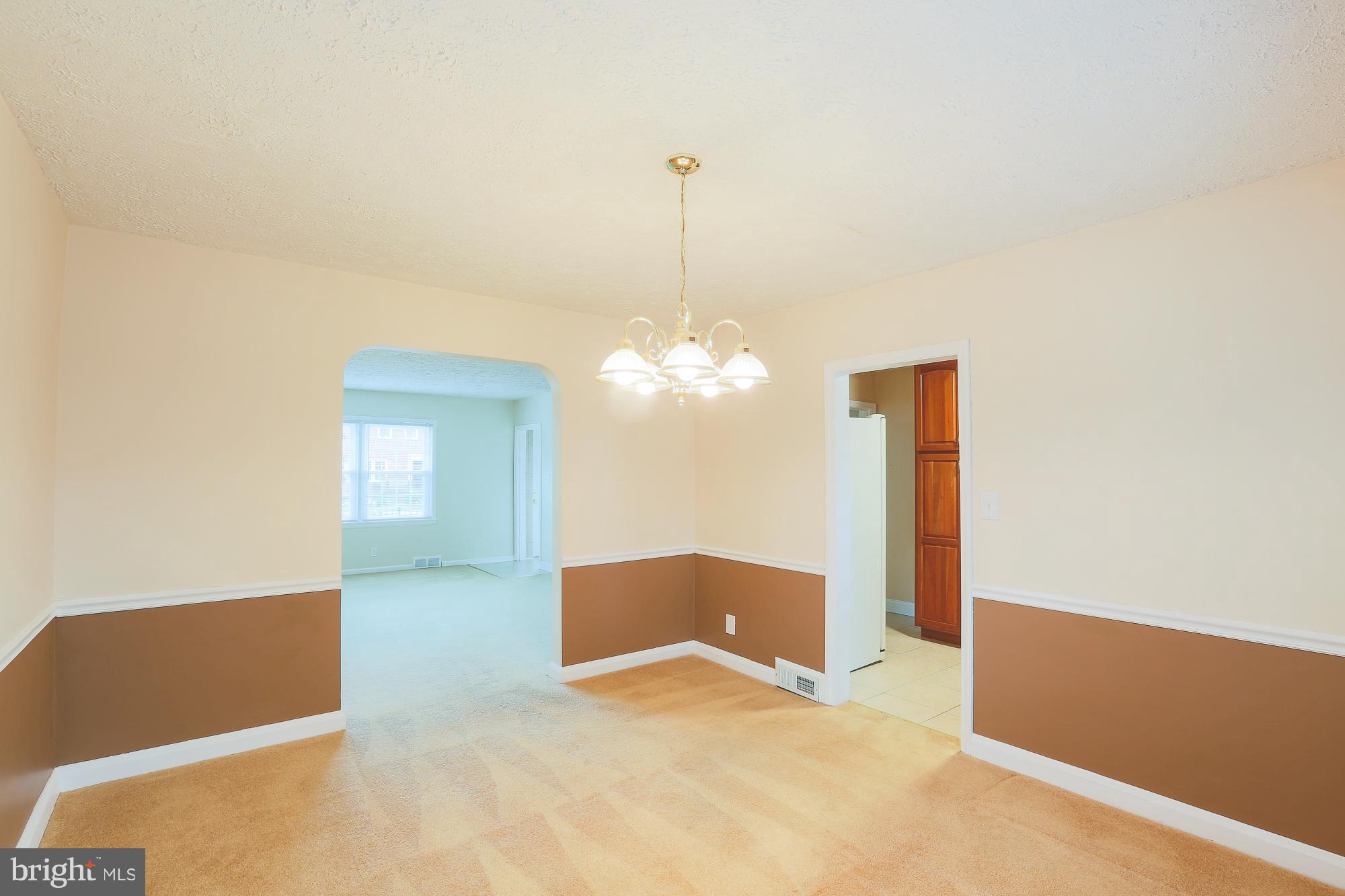 1727 Edgewood Road Towson, MD 21286 - Photo 16 of 29 a view of a room with a chandelier