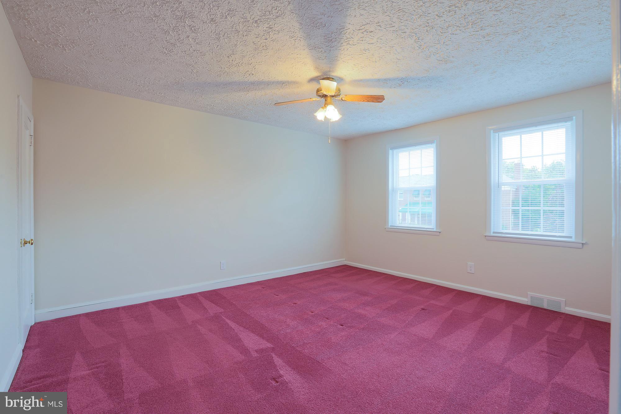 1727 Edgewood Road Towson, MD 21286 - Photo 22 of 29 an empty room with a window and ceiling fan