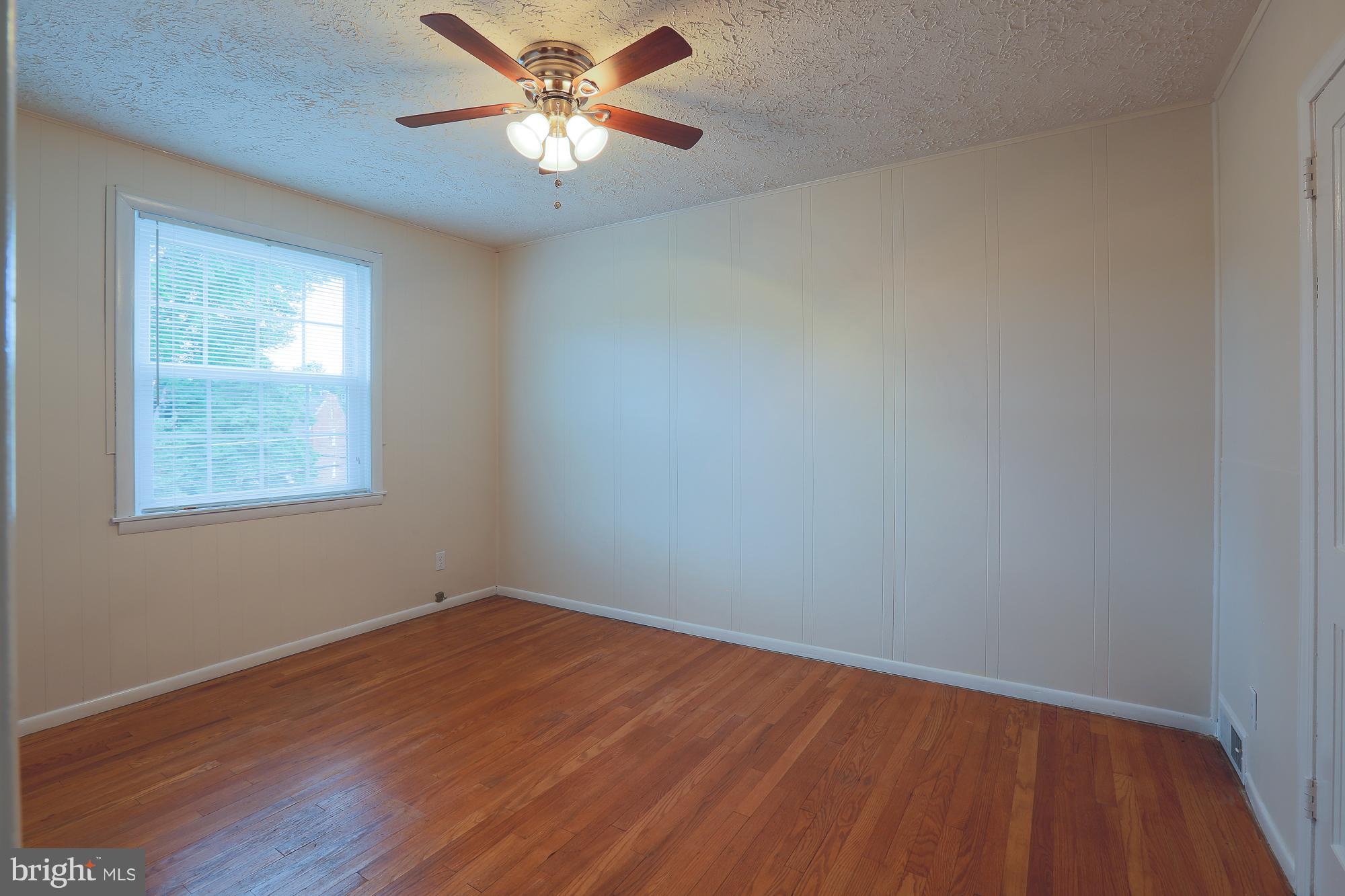 1727 Edgewood Road Towson, MD 21286 - Photo 23 of 29 an empty room with a window and a fan