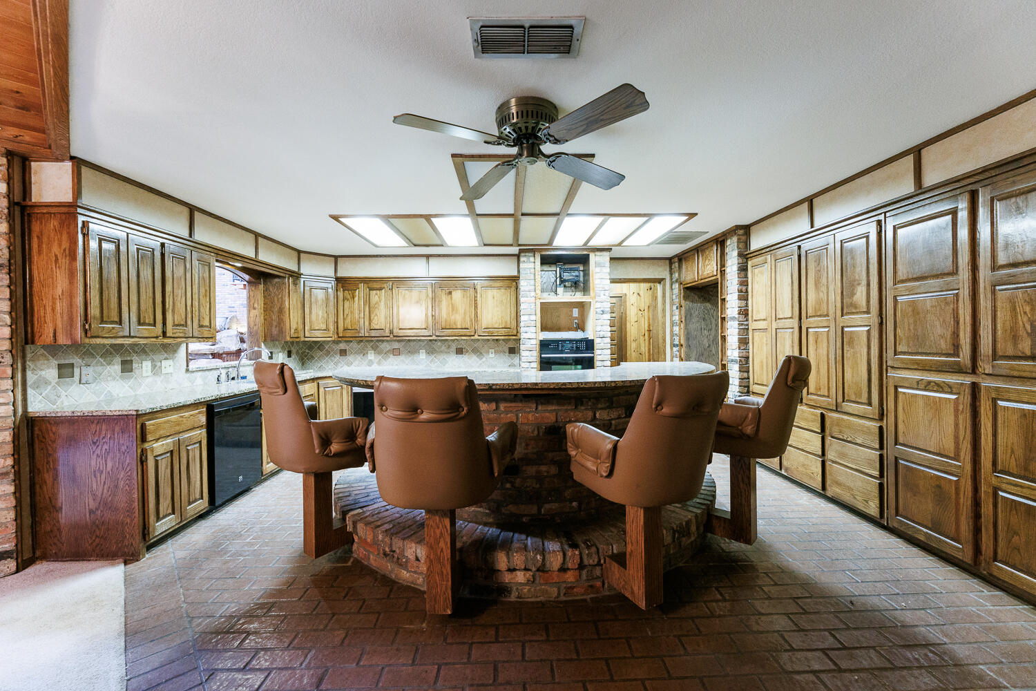 409 Mill Road Lubbock, TX 79403 - Photo 22 of 86 a view of a dining room with furniture window and wooden floor