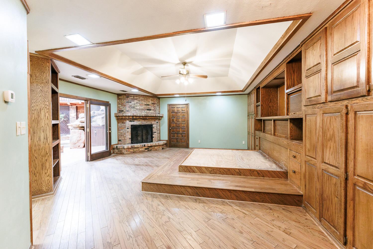 409 Mill Road Lubbock, TX 79403 - Photo 39 of 86 a bedroom with a bed and a fireplace