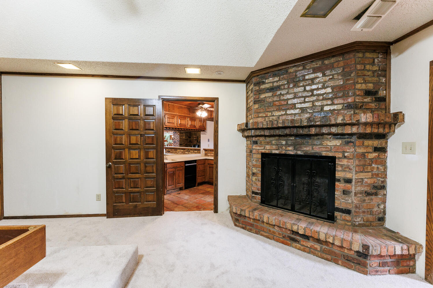 409 Mill Road Lubbock, TX 79403 - Photo 46 of 86 a living room with furniture a flat screen tv and a fireplace