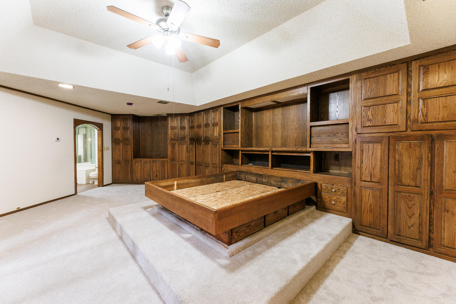 409 Mill Road Lubbock, TX 79403 - Photo 47 of 86 a spacious bedroom with a bed and cabinet