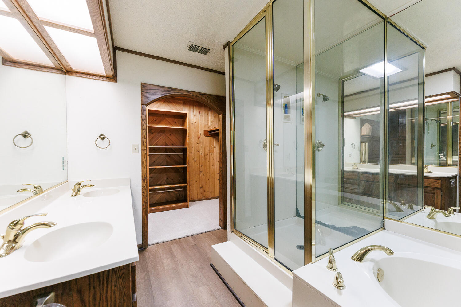 409 Mill Road Lubbock, TX 79403 - Photo 52 of 86 a bathroom with a tub and a sink