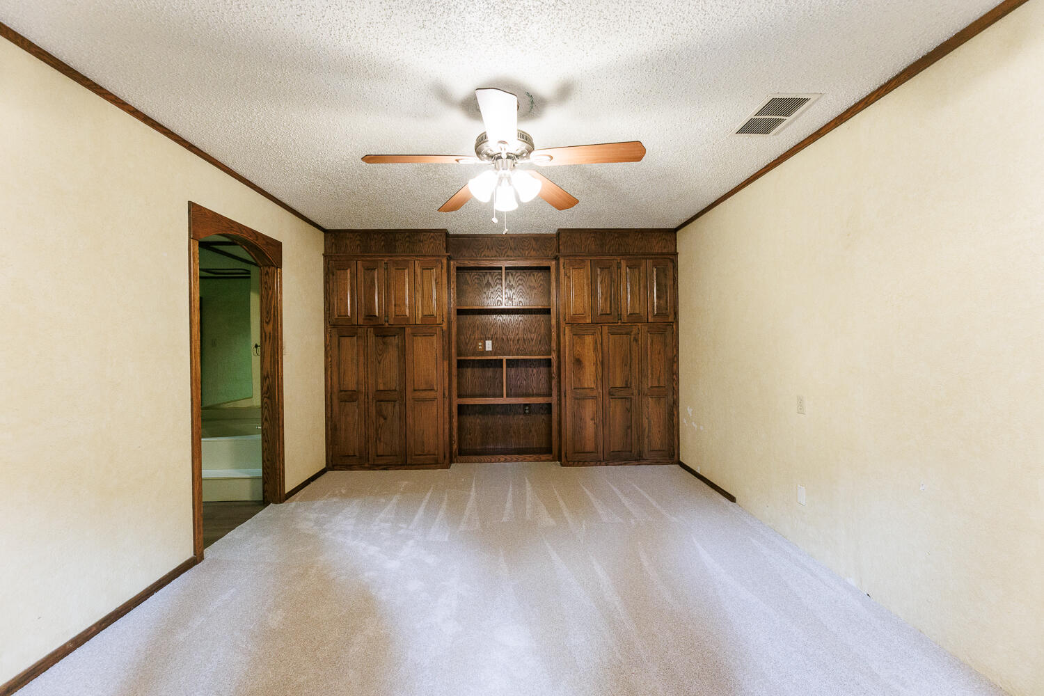 409 Mill Road Lubbock, TX 79403 - Photo 54 of 86 a view of an empty room with a ceiling fan