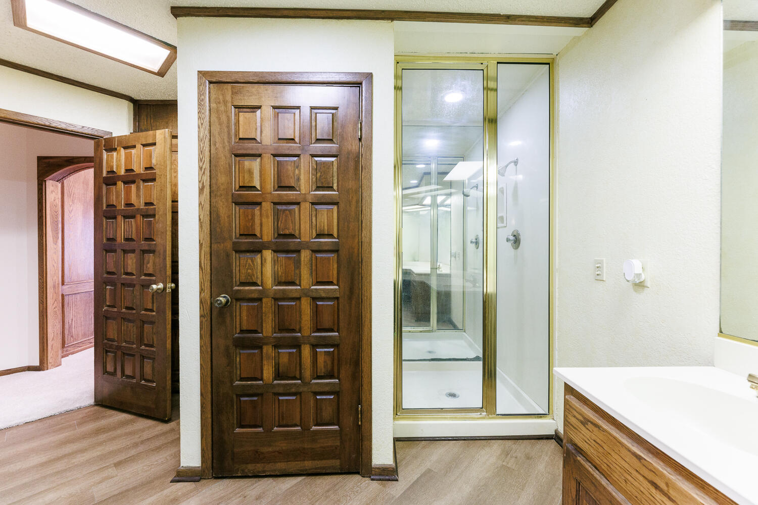 409 Mill Road Lubbock, TX 79403 - Photo 57 of 86 a view of a hallway with wooden floor and cabinet