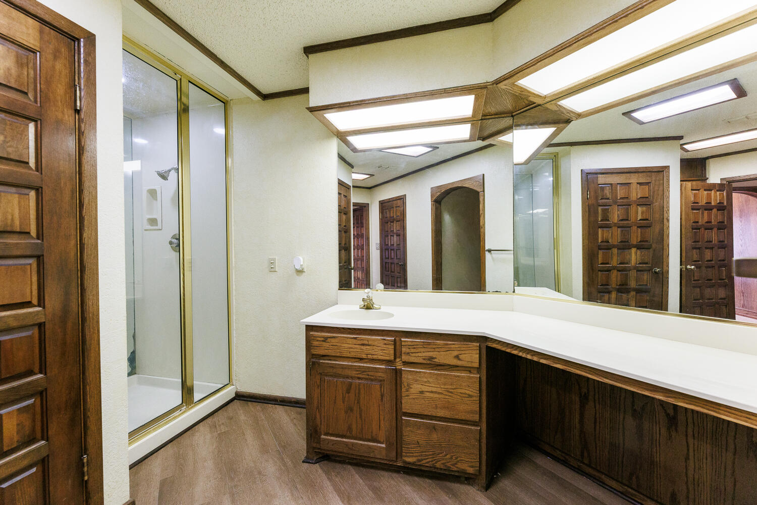 409 Mill Road Lubbock, TX 79403 - Photo 58 of 86 a bathroom with a granite countertop sink