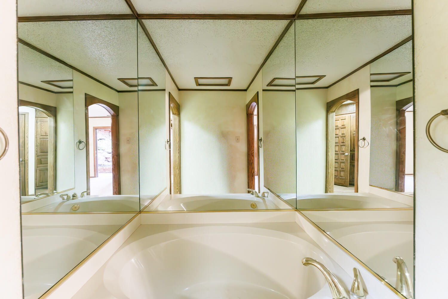 409 Mill Road Lubbock, TX 79403 - Photo 59 of 86 a bathroom with a granite countertop sink and a large mirror
