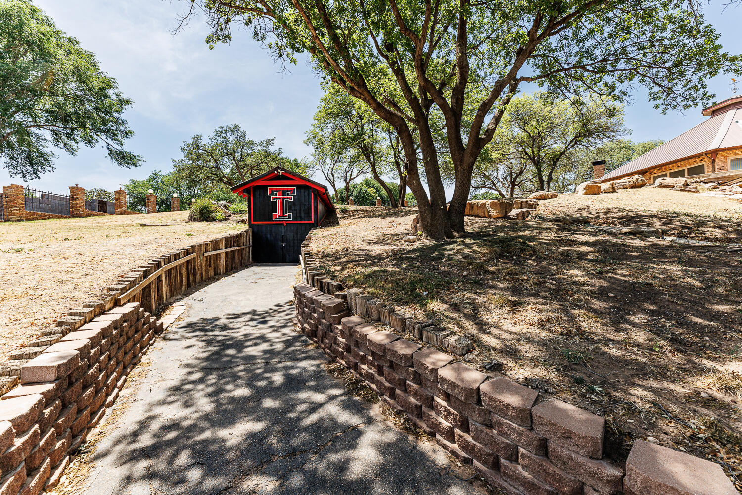 409 Mill Road Lubbock, TX 79403 - Photo 72 of 86 a view of a large yard with a tree
