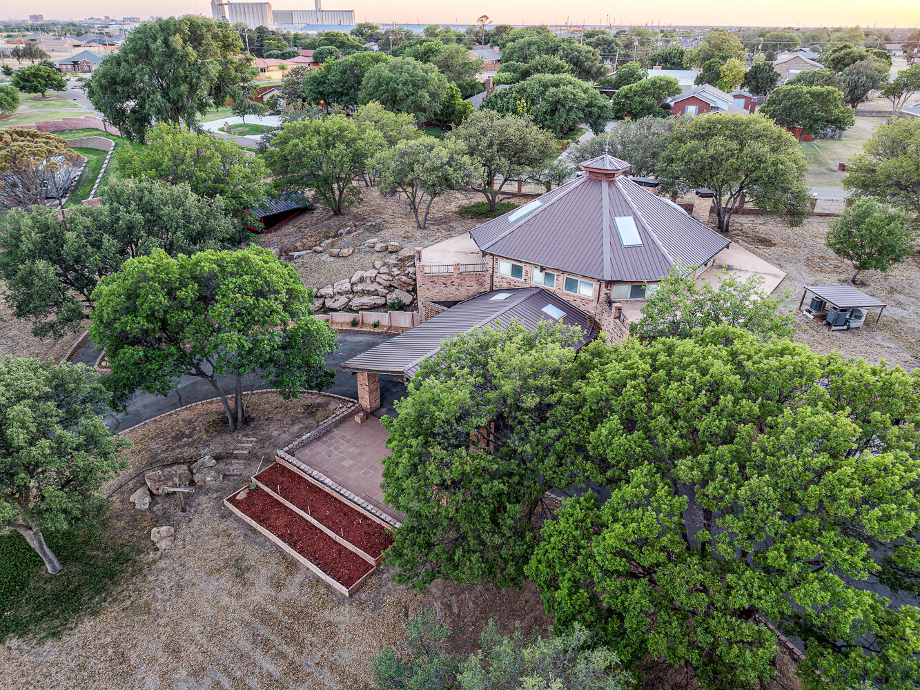 409 Mill Road Lubbock, TX 79403 - Photo 78 of 86 an aerial view of a house with a yard and lake view