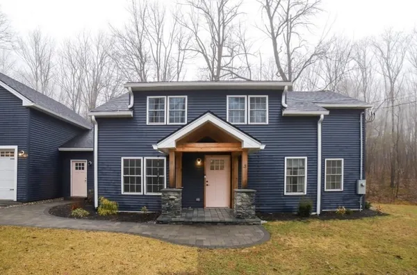 a front view of a house with a yard