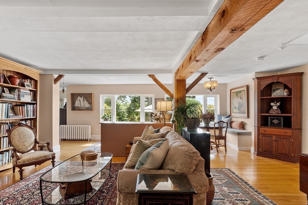 394 Plainfield Road, Unit 394 Concord, MA 01742 - Photo 13 of 40 a living room with furniture and a large window
