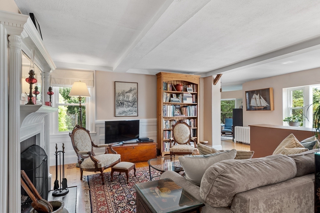 394 Plainfield Road, Unit 394 Concord, MA 01742 - Photo 14 of 40 a living room with furniture fireplace and a window