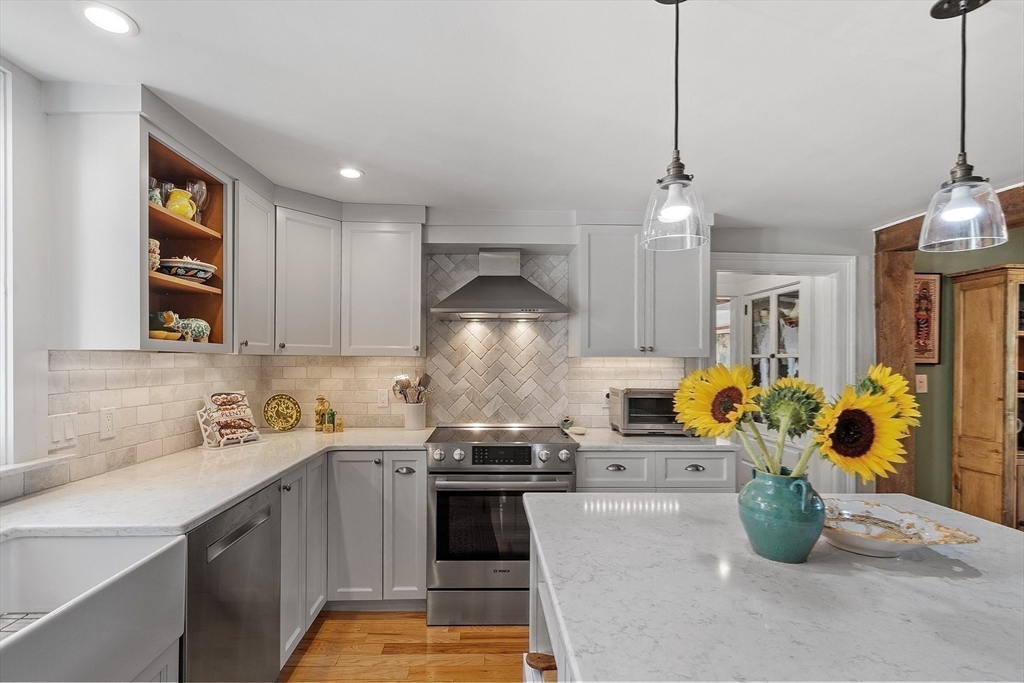 394 Plainfield Road, Unit 394 Concord, MA 01742 - Photo 17 of 40 a kitchen with a sink appliances and cabinets