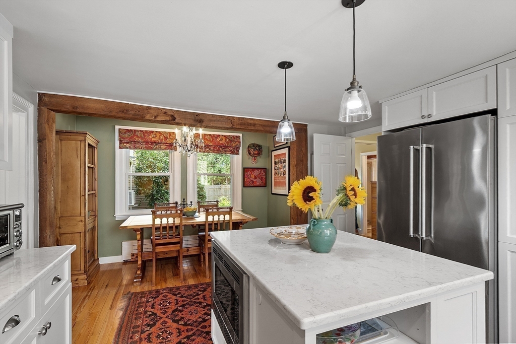 394 Plainfield Road, Unit 394 Concord, MA 01742 - Photo 18 of 40 a view of a dining room and a table or chairs