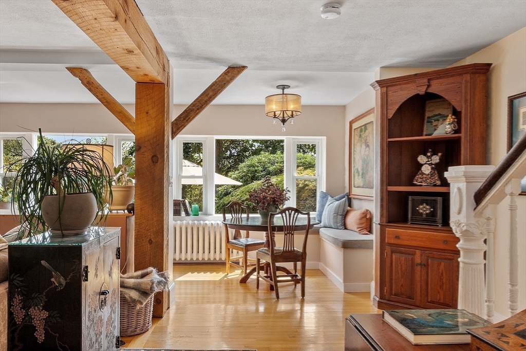 394 Plainfield Road, Unit 394 Concord, MA 01742 - Photo 25 of 40 a living room with furniture and a floor to ceiling window