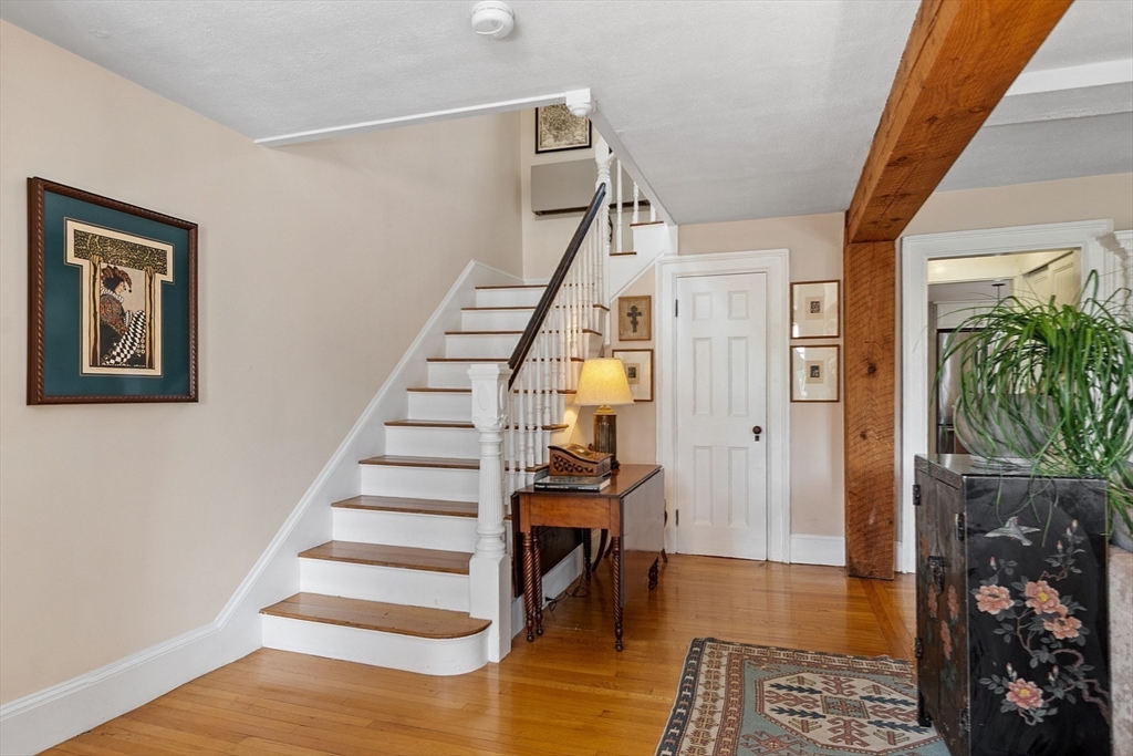 394 Plainfield Road, Unit 394 Concord, MA 01742 - Photo 26 of 40 a view of entryway and hall with wooden floor