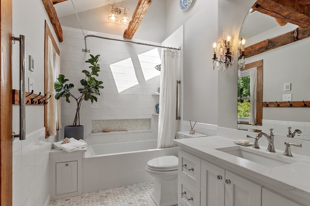 394 Plainfield Road, Unit 394 Concord, MA 01742 - Photo 29 of 40 a bathroom with a granite countertop sink a toilet and shower
