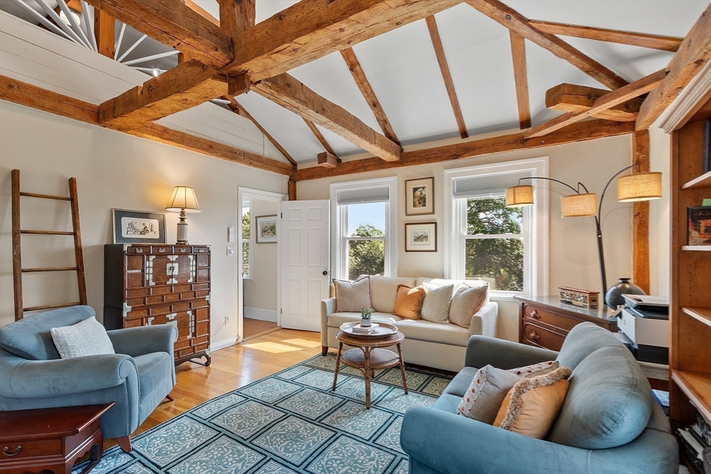 394 Plainfield Road, Unit 394 Concord, MA 01742 - Photo 31 of 40 a living room with furniture and a large window