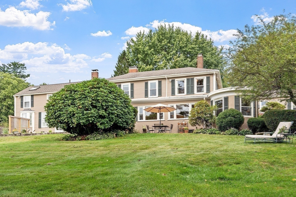 394 Plainfield Road, Unit 394 Concord, MA 01742 - Photo 35 of 40 a front view of a house with a garden