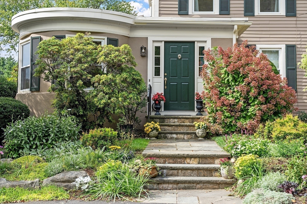 394 Plainfield Road, Unit 394 Concord, MA 01742 - Photo 40 of 40 a front view of a house with plants