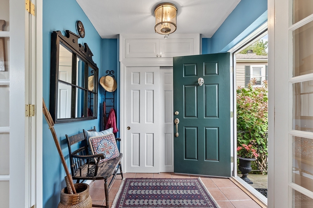 394 Plainfield Road, Unit 394 Concord, MA 01742 - Photo 9 of 40 a view of a hallway with entryway and wooden floor