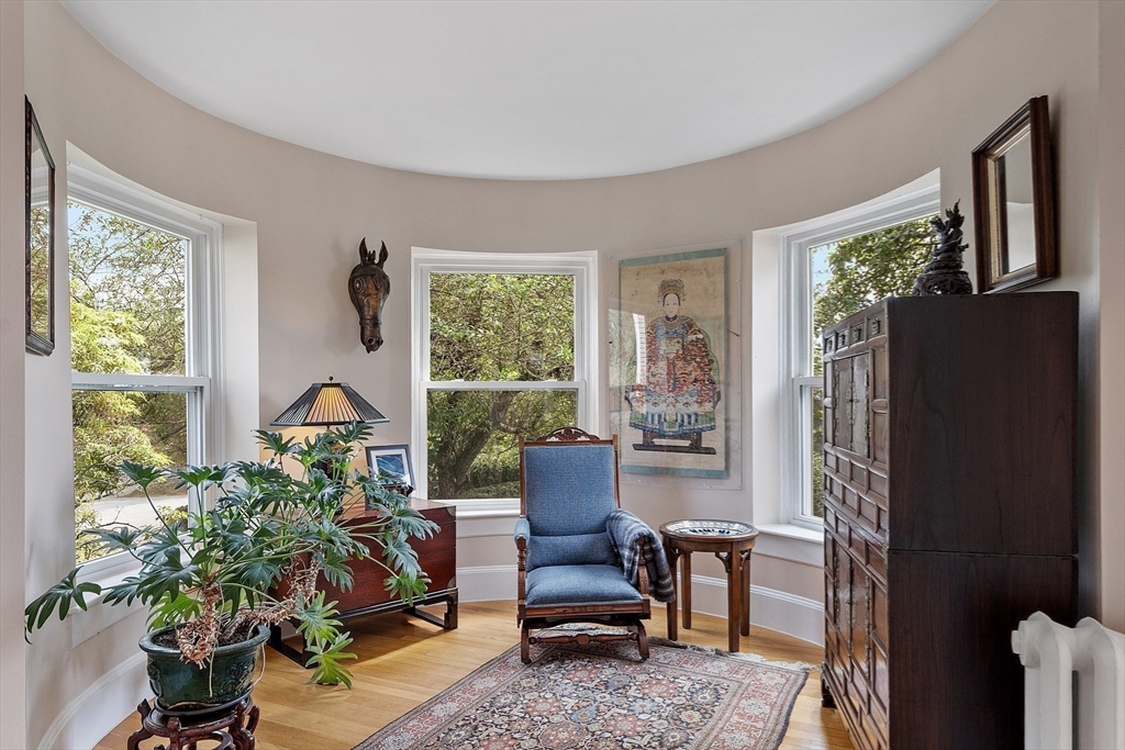394 Plainfield Road, Unit 394 Concord, MA 01742 - Photo 10 of 40 a living room with furniture and a potted plant