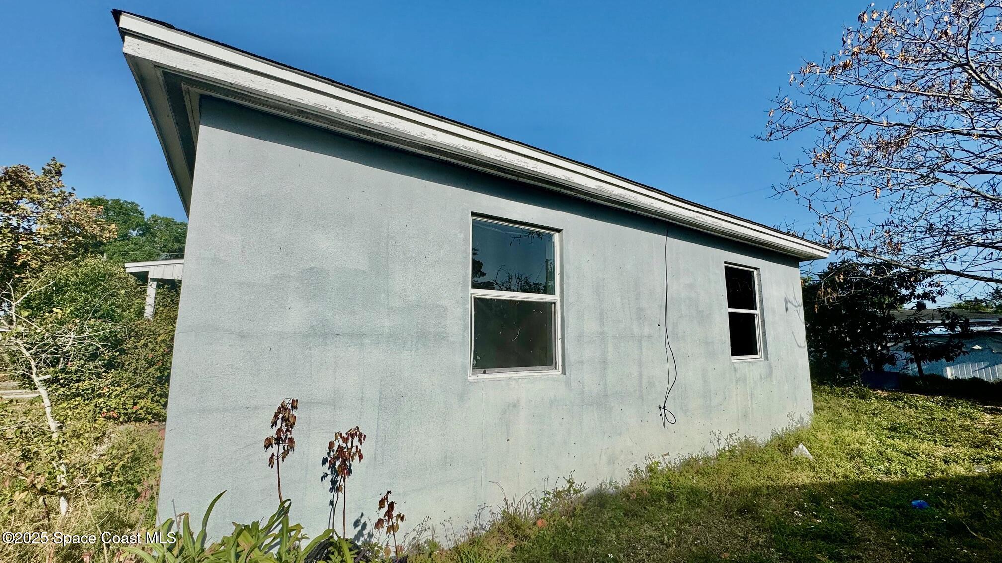 1050 Broadmoor Drive Cocoa, FL 32922 - Photo 3 of 16 east side of home