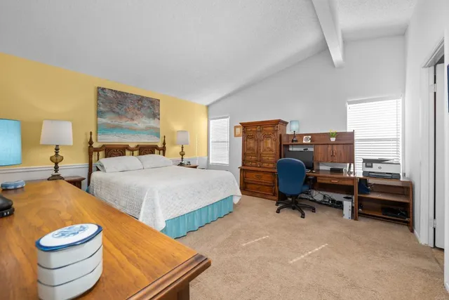 a bedroom with a bed and gym equipment