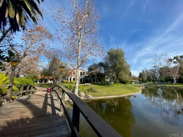 a view of a lake with a house in the background