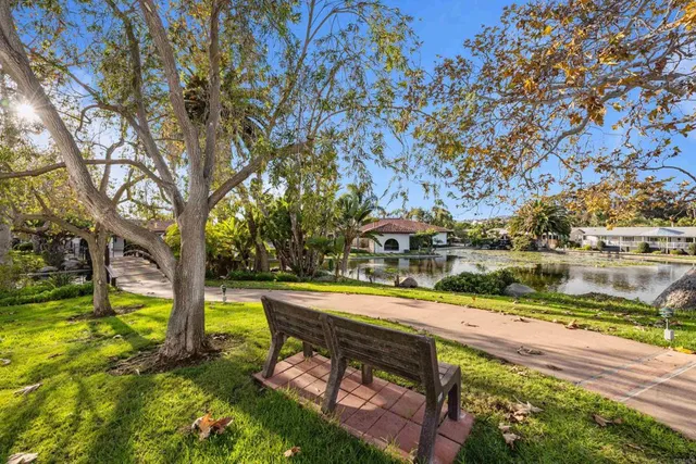 a view of swimming pool with a yard and sitting area