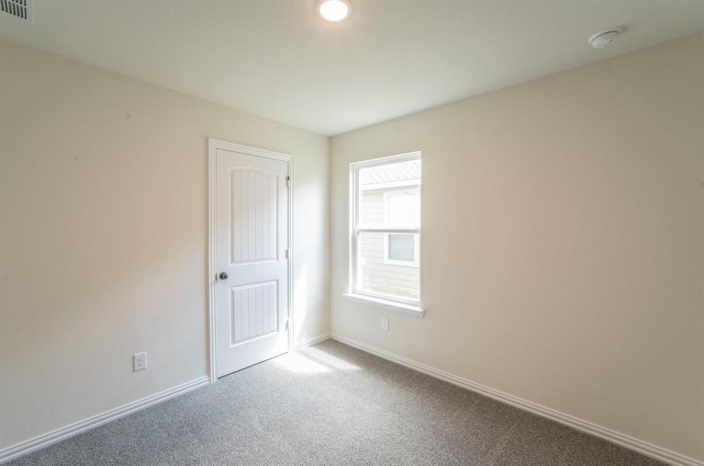 404 Rose Avenue Cleburne, TX 76033 - Photo 10 of 14 an empty room with windows