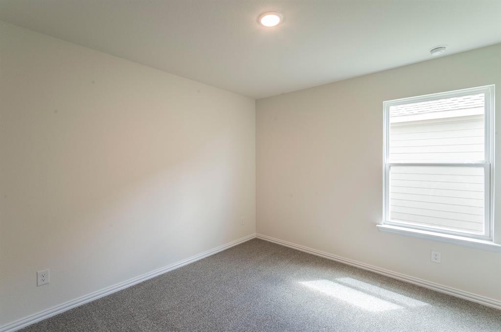 404 Rose Avenue Cleburne, TX 76033 - Photo 13 of 14 an empty room with a window