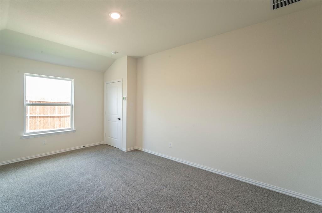 404 Rose Avenue Cleburne, TX 76033 - Photo 7 of 14 an empty room with a window