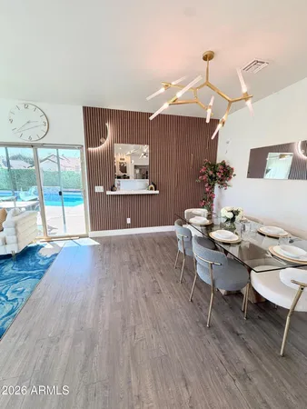 a view of a two chairs in the garden