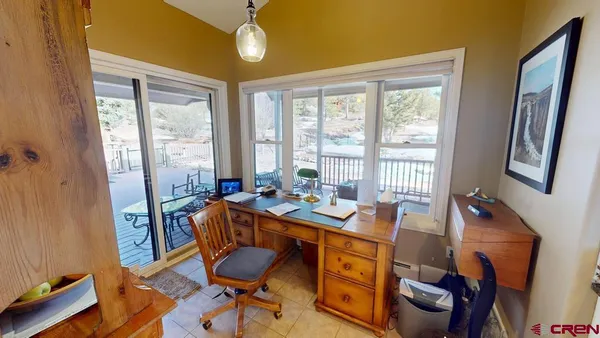 a view of a dining room with furniture window and outside view