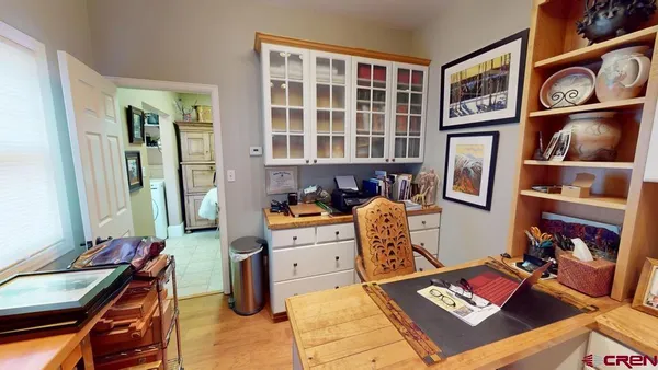 a bed room with a bed and a book shelf