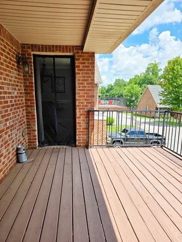 a view of outdoor space with wooden floor