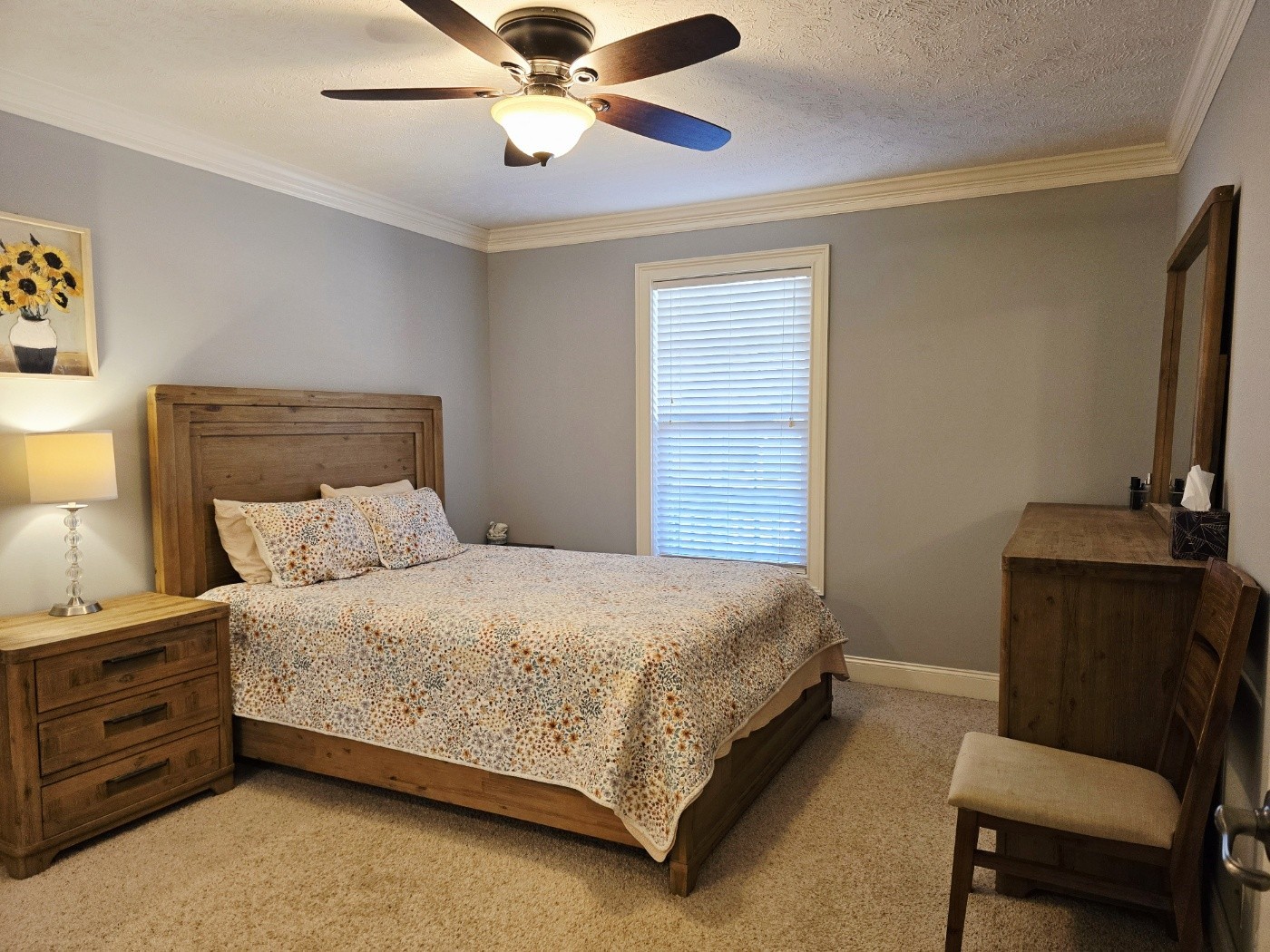 135 Excell Road, Unit 1003 Clarksville, TN 37043 - Photo 19 of 39 a bedroom with a bed and a chair
