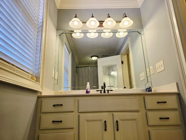 a bathroom with a sink and a mirror