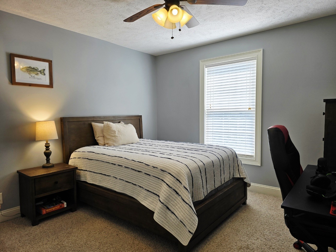 135 Excell Road, Unit 1003 Clarksville, TN 37043 - Photo 24 of 39 a bedroom with a bed and a chandelier
