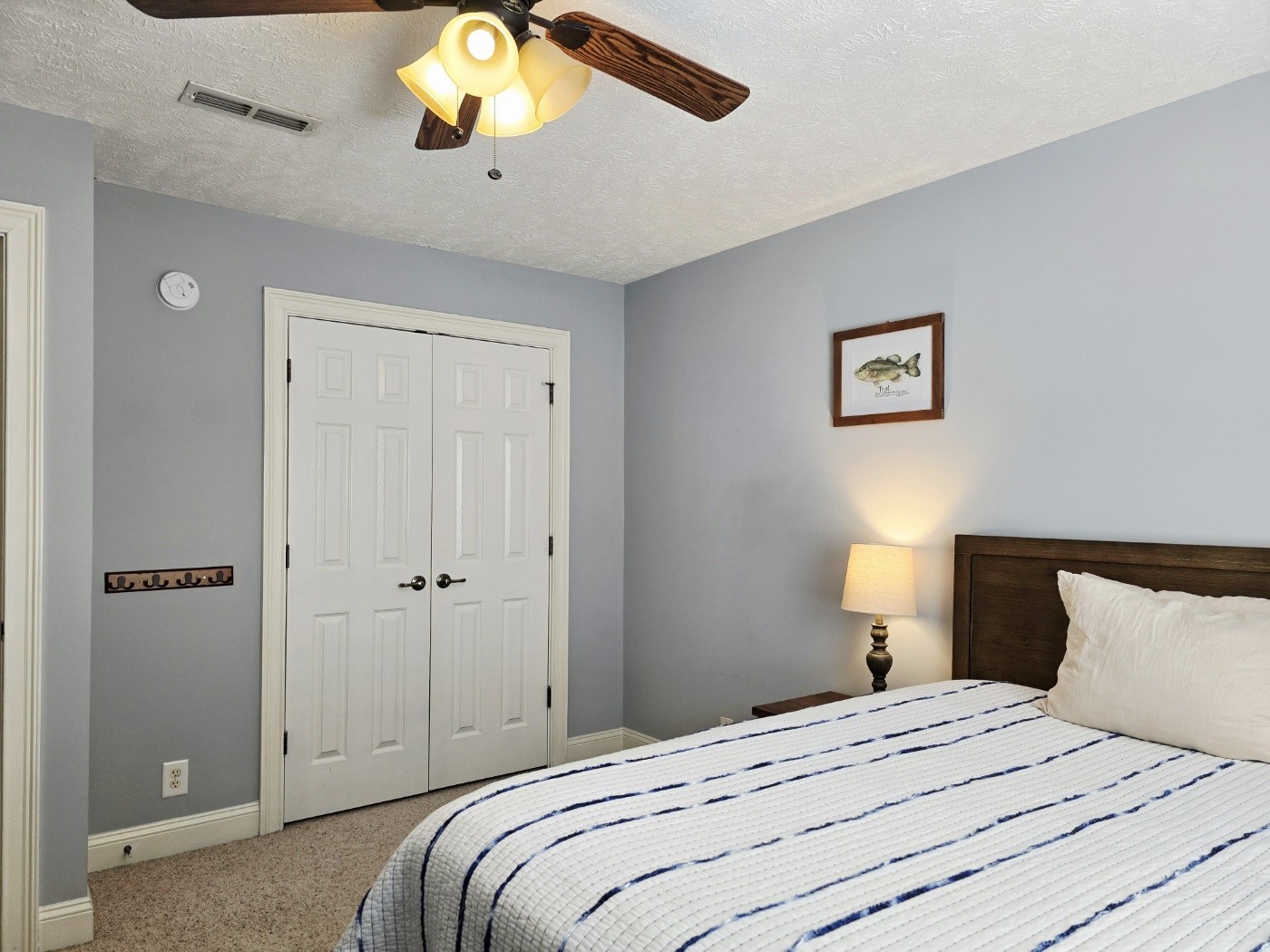 135 Excell Road, Unit 1003 Clarksville, TN 37043 - Photo 25 of 39 a bedroom with a bed and a chandelier