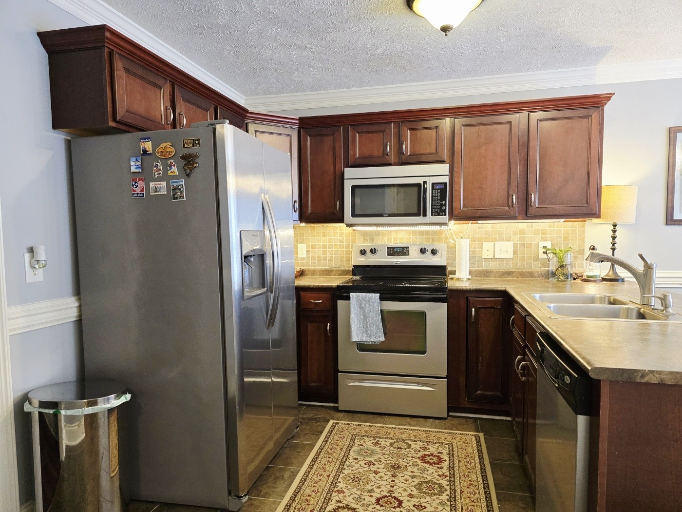 135 Excell Road, Unit 1003 Clarksville, TN 37043 - Photo 7 of 39 a kitchen with stainless steel appliances granite countertop a refrigerator stove and sink