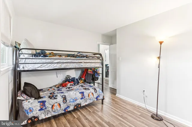 a bed sitting in a bedroom next to a small yard