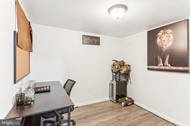 a view of workspace with wooden floor